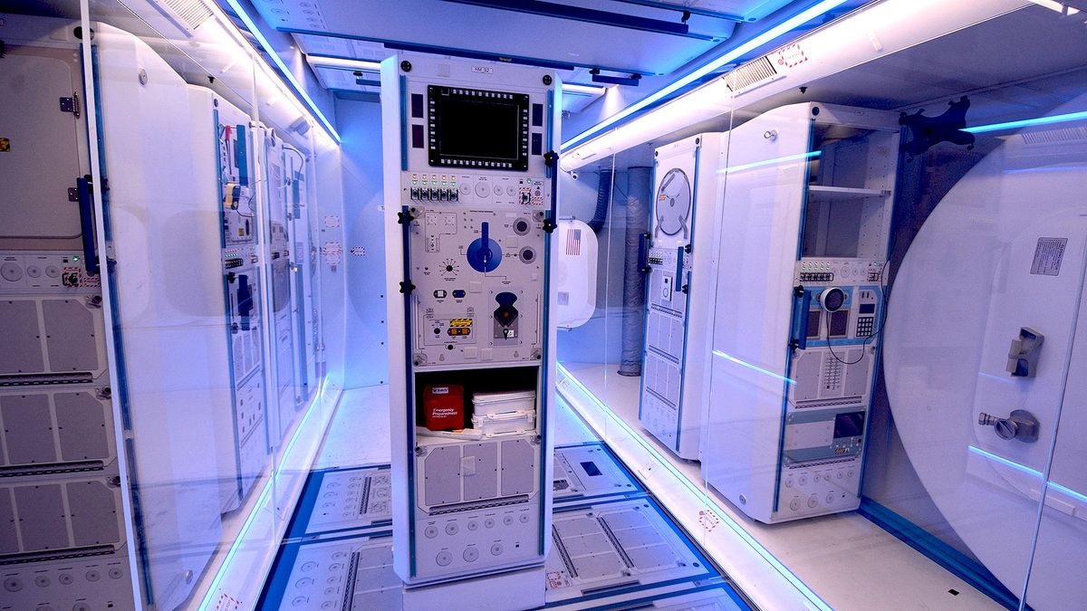 The interior of Northrop Grummann's lunar orbit habitat mockup includes science racks, docking ports and astronaut crew quarters in a layout similar to the International Space Station. 